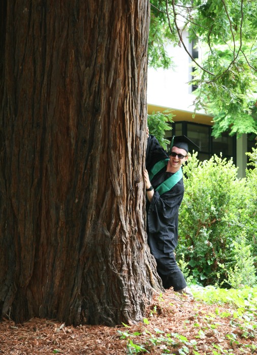 8. goofy grad behind a tree